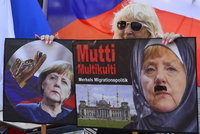 ONLINE: Merkelovou v Praze uvítal pískot. Od Zemana dostala Švejka